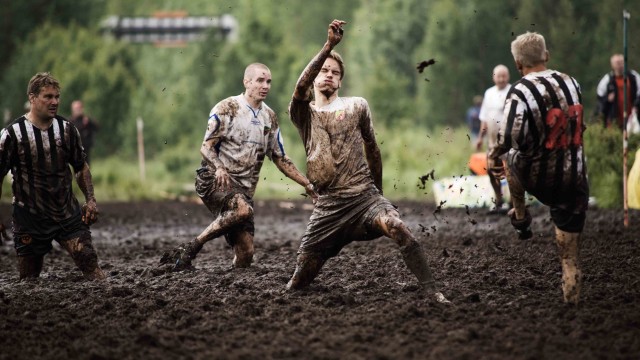 Players in action during a mach at  the Swamp Soccer Championships in Hyrynsalmi on 15 July 2011, Finland EPA/JOHANNA KANNASMAA FINLAND OUT